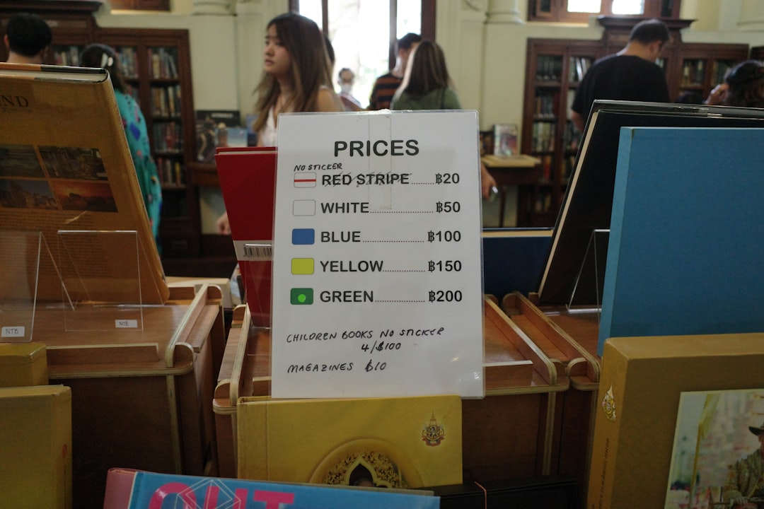 book-sale-prices-are-listed-on-a-sign-9szw-nrmfwe